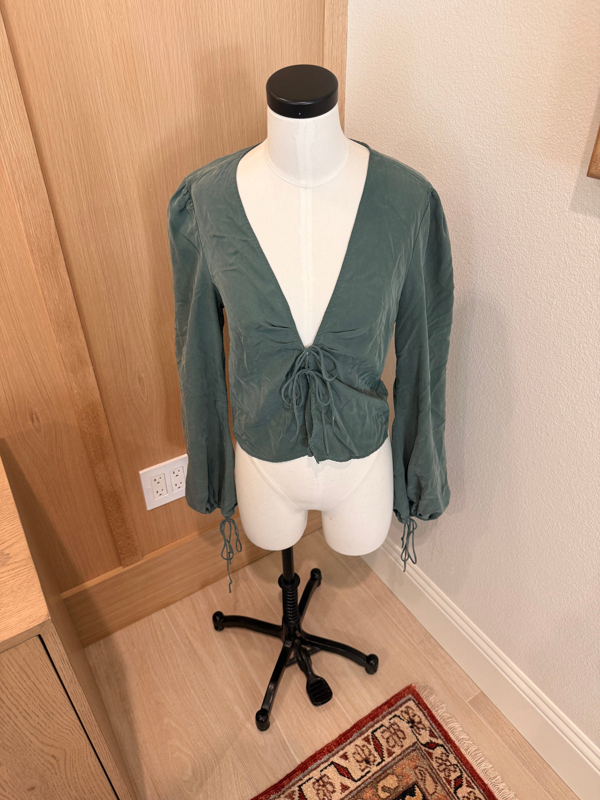 Emerald green tied blouse