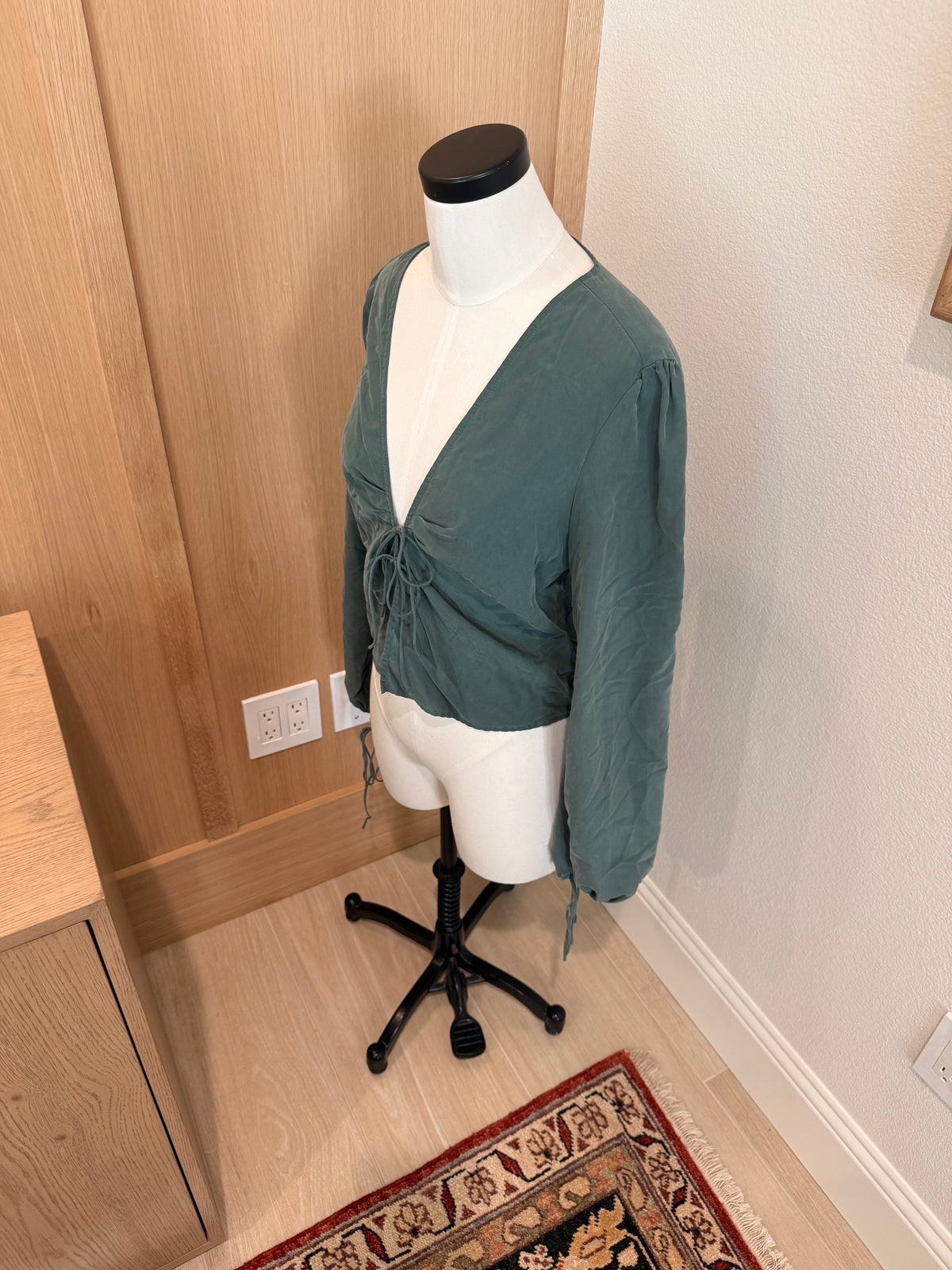Emerald green tied blouse